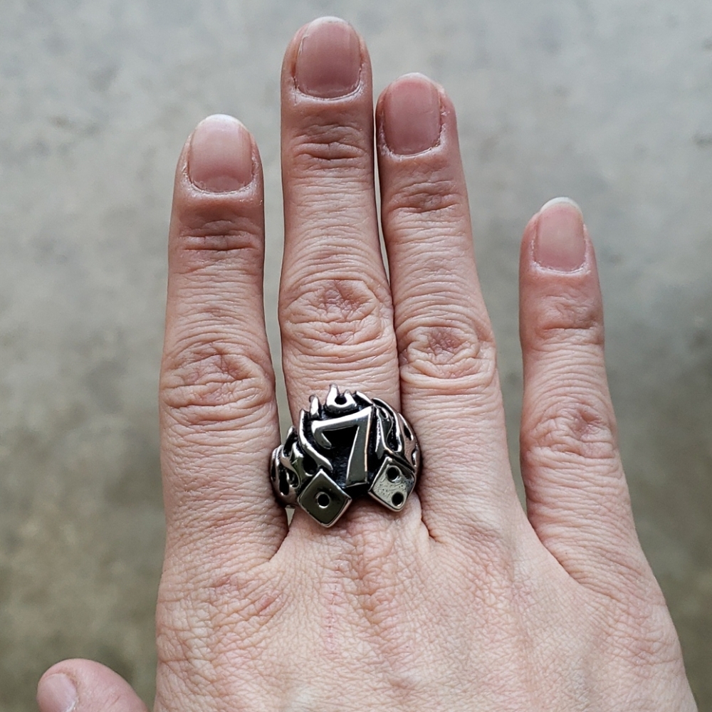 Stainless steel ring with # 7 and dice on it